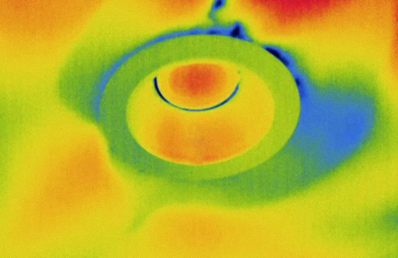 This is a short - wave infrared (SWIR) imaging or thermal imaging graph, which uses colors to represent the distribution of temperature or infrared light intensity. In the image, the red and orange areas represent regions with high temperature or high infrared radiation, while the blue and green areas correspond to regions with low temperature or low infrared radiation, and yellow serves as a transition color. A circular and arc - shaped structure is visible at the center, with a significant color gradient. It may be used to detect the heat distribution, material defects of electronic components, industrial parts, etc., or to identify the internal structure of an object by means of infrared. In scenarios such as industrial defect detection and scientific research analysis of thermal behavior, through the visualization of invisible light and heat, it helps to judge the equipment status and material properties.